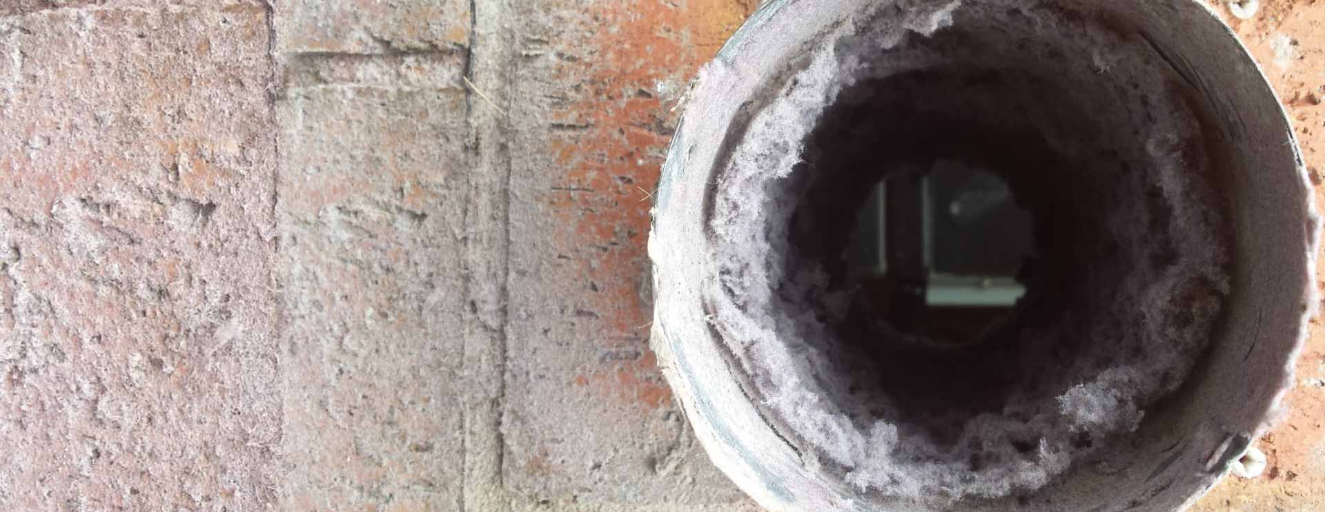 Duct Cleaning to remove lint from commercial washing machine pipes